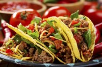 Plate of Mexican hard shelled tacos.