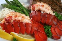 Keep grilled petite lobster tails succulent by brushing with butter or oil.