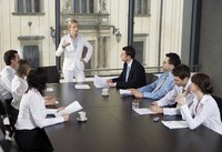 Woman leading business meeting in office