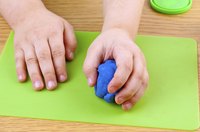 Kneading the Play-Doh will help to soften it.