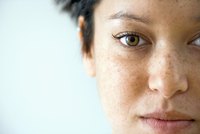 Apply makeup in natural light to avoid layering too much product on your skin.