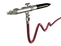 An airbrush offers greater control and detailing on metal crafts.