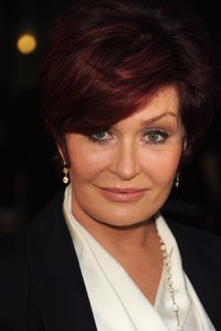 Don an auburn wig to pull off Sharon's look.
