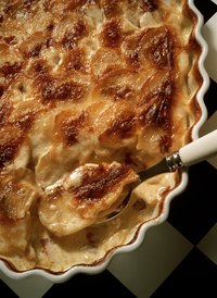 Bake potato gratin until it's warm and bubbly.
