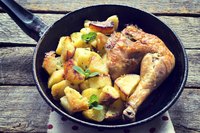 Sear chicken, then bake with potatoes and veggies for a one-pot meal.