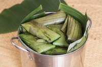 Line the steamer with corn husks for even cooking.