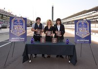 Musicians posing for a photo at a corporate sponsored event.
