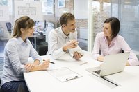 Smiling young workers in business office