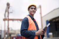 A man is wearing protective gear at work.