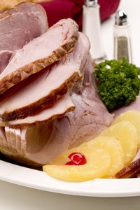 Serve ham with fruit as a tasty, colorful garnish.