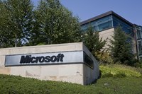 A Microsoft sign in front of a building on the company's campus in Redmond, WA