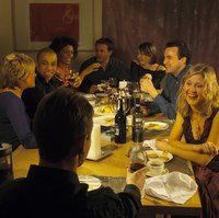 A business dinner often includes ice-breakers and other games for dinner party members to get to know each other better.
