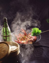 Halve a boiled lobster and brush with butter for a more elegant presentation.