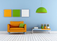 Orange, green and blue create triadic decor here, with white to diffuse the intensity.