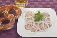 Once poached, the sausage can be served warm or cold.