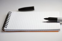 The permanent ink of a black Sharpie marker writes even on glass.