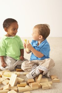 Children sharing toys shows good manners.