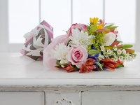 Two or three slim floral stems can be inserted into a flower vial.