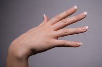 Achieve nails that look natural by applying acrylic nails.