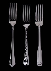 Drilling holes in sterling silver forks may be necessary to make jewelry.