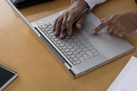 Businessman typing at computer