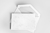 Image of a blank invitation on a gray background.
