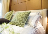 Bed pillows and throw pillows in a bed.