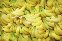A pile of bananas at a market.