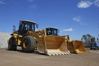Two large bulldozers at a construction site
