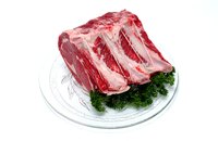 You can get uncooked bones from trimmed prime rib from your butcher.