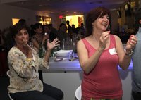 Employees clapping at a company event.