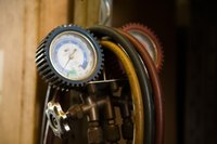 An air compressor provides the power to run an air chisel.
