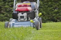 Close-up of lawn mower on grass