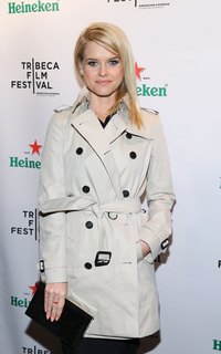 Alice Eve wears her trench unbuttoned and belted at the Tribeca Film Festival 2013 after party in New York.