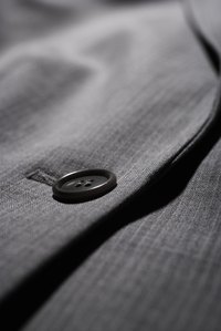 Pinch the layers around the bottom buttonhole of a suit jacket to determine if the lining is fused or canvassed.