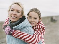 Mother and daughter wearing wool sweaters.