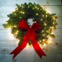 Hang your lighted wreath indoors to add ambiance to holiday decorations.