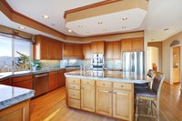 New luxurious wood kitchen with cabinets.