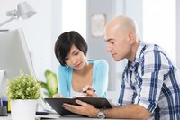 New hire going over policy statement with boss