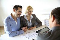 A couple is meeting with their financial adviser.
