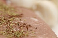 Baste grilled or broiled pork tenderloin to prevent herbs on the surface from scorching.