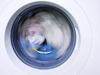 Adding bleach to your washing cycle can help to remove color from white nylon fabrics.