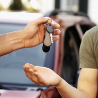 Man handing over car keys.