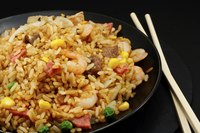 Japanese fried rice (cha-han) on matte black round plate.