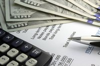 Close-up of calculator, cash and allowance data on table