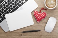 Valentine, card, computer and coffee at office desk.
