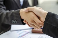 Businessmen shake hands.