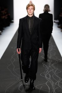 A model at the 2015 Mercedes-Benz Fashion Week shows off neatly bloused pants.