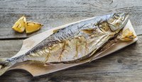 Cooked yellowtail on cutting board