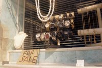 A close-up of items for sale in a pawn shop window.